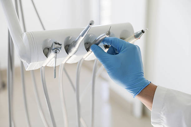 Professional Tooth Extraction technician working in Cocoa West, FL